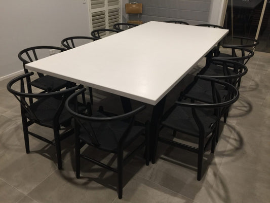 white tripod concrete dining table